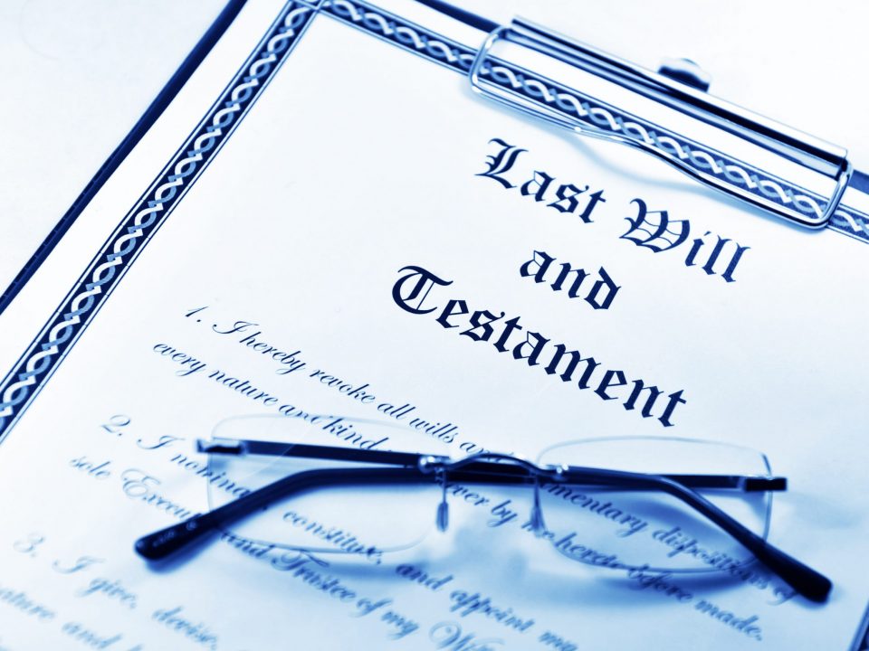 picture of last will and testament with glasses on it